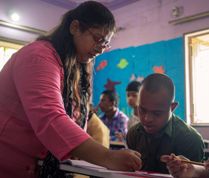 Volunteer Teaching Children at STK centre